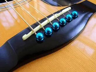 How to remove a broken acoustic guitar string