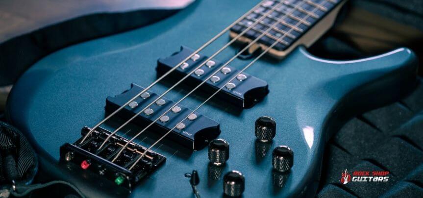 Why are bass guitars necks longer than other guitars